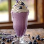 Lavender Blueberry Dream Shake served with whipped cream and fresh blueberries.